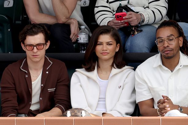 Zendaya and Tom Holland cuddle up at the tennis for a sporty date night