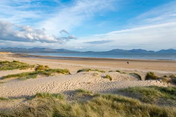 ‘Stuff of dreams’ Welsh beach with mountains, lighthouse and forest that people are going crazy for