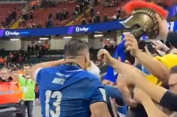 Wales v Italy player of the match downs a pint on side of Principality Stadium pitch