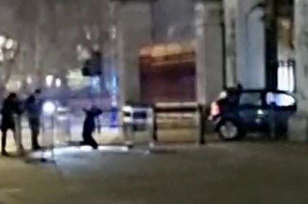 Car rams gates at Buckingham Palace as armed police surround driver