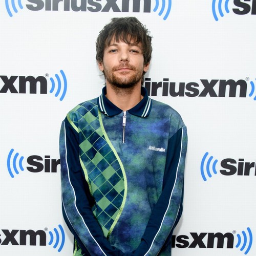 Louis Tomlinson compared himself to his One Direction bandmates for ‘a long time’