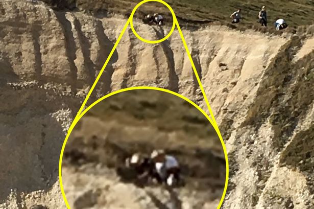 ‘Idiot’ walkers caught on camera on cliff edge – despite fact it keeps collapsing