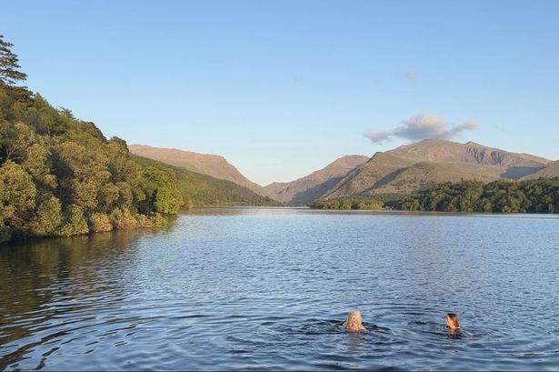 The lakeside walk that ends in a swim with a view of mountains you need to add to your summer bucket list right now