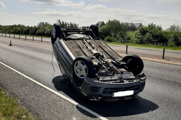 Car flips onto roof after ‘driver spooked by spider’