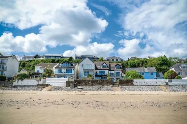 Rare chance to buy a house on a prime coastal street with the beach at the end of the garden