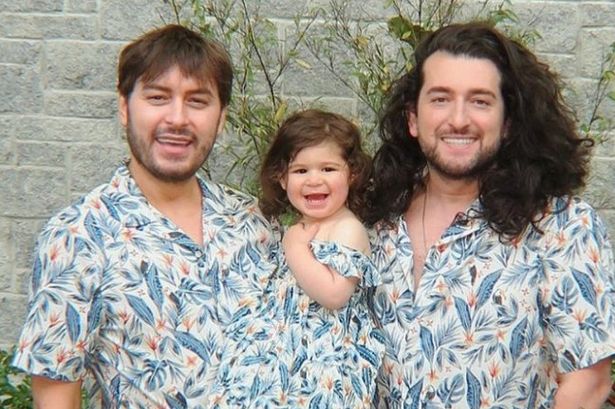 Brian Dowling and partner Arthur twin with daughter in matching M&S summer outfits