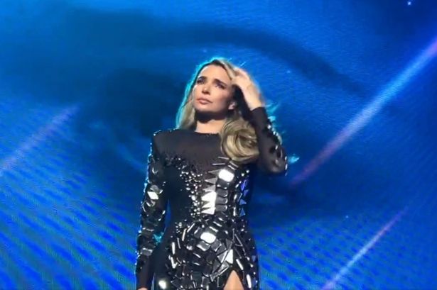 Girls Aloud’s Nadine Coyle breaks down in tears onstage during Sarah Harding tribute and is comforted by Cheryl, Kimberley and Nicola